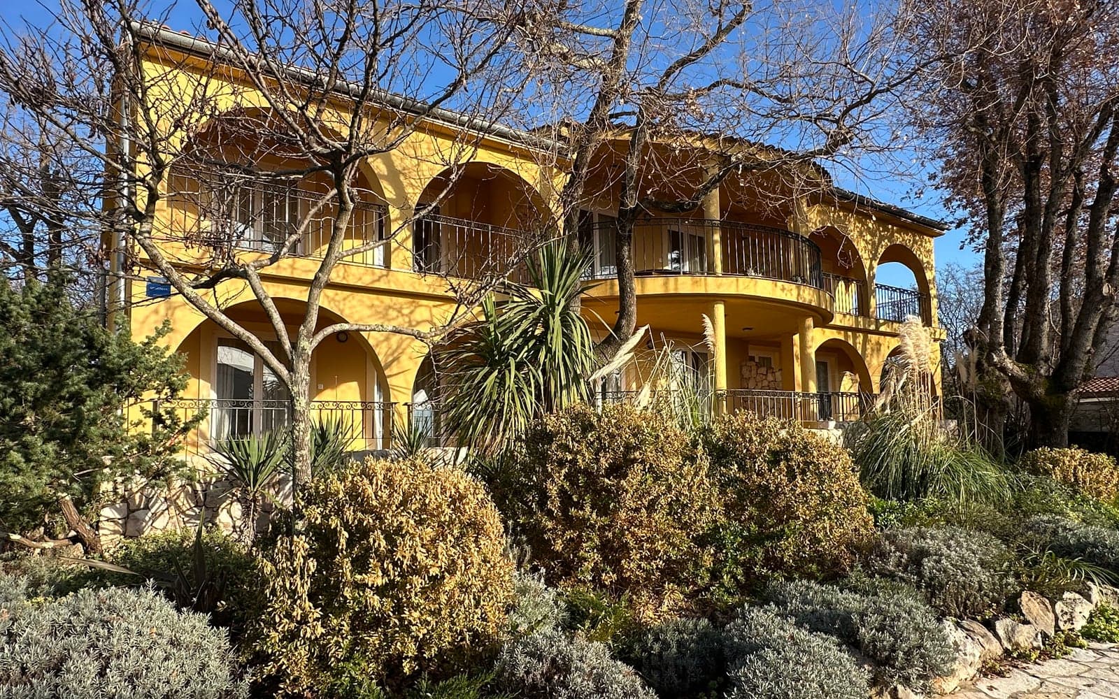 Ava building — yellow apartment building at Lotus Resort